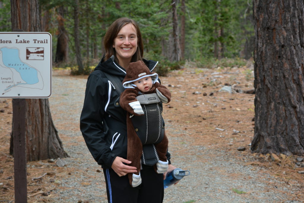 Mom on hike with baby in carrier.
